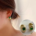 Elegant C-shaped golden earrings with square green gemstones worn by a female model - Gold C-Shape Earrings with Square Green Gemstone(ED1921-2)