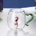 Macro detail of heat-resistant glass mug with green wavy handle and 3D snowman inside - Snowman