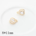 Macro shot of two golden zircon heart star charms for DIY jewelry 8x11mm size - Round