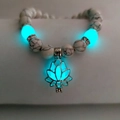 Luminous white turquoise bead bracelet featuring a glowing blue hollow lotus charm - White Turquoise Cyan Glow