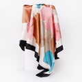 Detailed close-up of a floral print satin scarf with elegant black border on a white pedestal - 90x90cm / Pink (D9223)