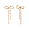 Elegant 18K gold plated bow earrings with white pearl pendants on white background - Imitation Pearl Bow Earrings - Gold