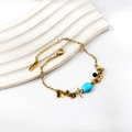 Bracciale in acciaio inossidabile dorato con pietre ovali blu e ciondoli a moneta - Stile Pietra Ovale Blu (BR26150KG)