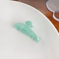 Sparkly mint green shark-shaped hair claw clip with fine gold glitter in translucent finish - 5cm / Green