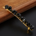 Macro detail of natural black crystal stones hand-wrapped with gold wire on a hair clip - Obsidian + Gold Clip