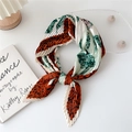 Pleated square scarf featuring brown leopard print and green leaf patterns on white - Leaf Leopard Print Orange