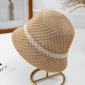 Women's khaki knit bucket hat with white wavy stripes on a stylish gold display stand - One Size / Khaki (Beige Stripe)