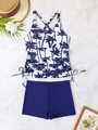 Flat lay of tankini swimsuit with palm tree print and drawstring details on marble background - S / Blue