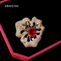 Elegant floral brooch with red gemstone and micro-set zircons, size 2.8cm by 2.7cm - Red Gem Oval Style (B889)