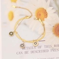 Détail macro du collier double rang en acier doré avec pendentifs œil du diable - 9# Bracelet-Huile de Goutte d'Oeil à Double Couche