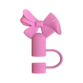 Close-up of pink silicone bow straw cover accessory with ring for Stanley cups - Pink