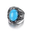 Vintage oval turquoise ring with engraved silver metal band on a clean white background - Silver+Turquoise