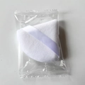 Single white triangular velvet makeup sponge with ribbon handle in clear packaging - Candy Bag Packaging / White