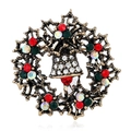 Macro detail of Christmas wreath brooch with bells, holly leaves and colorful rhinestones - BR1328 Antique KC Gold Wreath Bell