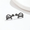 Detail view of mini turtle stud earrings in sleek black stainless steel finish - Black