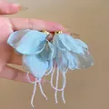Detail of light blue fabric flower earrings with heart studs and white bead tassels - Style 43 White Flamingo Leaf
