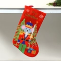 Detail of red Christmas stocking with nutcracker soldier hanging on a white table edge - Red Nutcracker Mouse