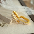 Rectangular gold-plated hoop earrings with baguette-cut zircons on a marble stone base - White Rectangular Zirconia Huggie / White