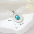 Macro view of silver oval pendant with turquoise, zircons and measurements 25mm x 15.7mm - Palladium H-11779 Turquoise Oval