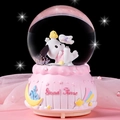 Pink musical snow globe featuring a white cartoon dog and castle base with Good Time text - Pink