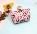 Detailed close-up of pink unicorn cartoon coin purse with zipper and floral decorations - Unicorn-6