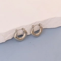 Detailed close-up of chunky U-shaped silver stainless steel earrings with hinged snap closure - Silver Mirror U-Hoop