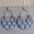 Detail of bohemian gold hoop earrings with blue and white patterned wooden crescent pendants - Blue Leaves