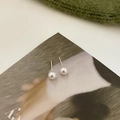 Elegant white pearl stud earrings with minimalist silver posts on an artistic background - White Pearl-6mm