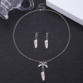 Detailed shot of silver cleaver pendant necklace and earrings with Killing It engraving - Bow Chef Knife Stud Earrings Necklace Set