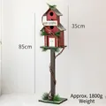 85cm Christmas wooden birdhouse on stand with Merry Christmas sign and pine accents - Letter Sign Birdhouse Style