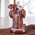Brown ceramic backflow incense burner with a conical incense cone and waterfall smoke effect - Mountains and Rivers Meeting