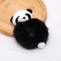 Dettaglio dell'elastico per capelli a forma di panda in morbido peluche sintetico - Nero