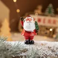 Miniature resin Santa Claus figurine holding a small tree for Christmas desktop decor - Small Santa Claus Style D (Holding Christmas Tree)