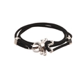 Detail of black woven cord bracelet featuring a polished silver octopus charm on white background - Octopus / Black
