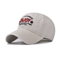 Detailed close-up of beige cotton baseball cap with colorful ENJOY embroidery and stitching - Beige