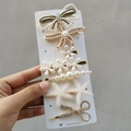 Detailed macro of candy-colored hair clip set with pearls and rhinestones - Double Star (7 Piece Set)