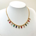 Golden necklace with rainbow colored rectangular zircons and tassels on a white model bust - Rectangle Style (TZ-N0799-02-changfangxing)