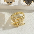 Verstellbarer goldener Ring mit luxuriösem Wirbel-Design und Zirkonia-Steinen im Baguette-Schliff - Kreuzring Mit Weißen Zirkonia