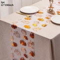 Halloween table runner featuring golden pumpkin and leaf prints on sheer black fabric - Small Leaves Pumpkin