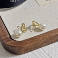 Elegant gold hollow heart pearl earrings with white round drop on wooden tray - 37# Hollow Out Bear Pearl Earrings