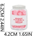 Detail showing the 6.2cm by 4.2cm dimensions for the pink LOVE jar embroidery patch - Heart Jar