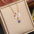 Detail of gold evil eye pendant with blue enamel on a beige leather jewelry box - Evil Eye Round Pendant (4#)