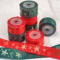 Detail of red and green ribbed Christmas ribbons with gold Merry Christmas print - 2.5cm Reindeer Red (5 Yards)
