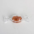 Orange natural crystal stones inside a candy-shaped transparent decorative container - Red Aventurine - 1PC