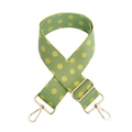 Close-up of green canvas shoulder strap with yellow polka dots and gold metal hardware - Gold Buckle / Dark Green