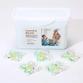 5-in-1 concentrated laundry detergent pods in a storage box with green flower shapes - 5-in-1 Rotating Camellia 50 Capsules Boxed