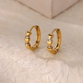 Minimalist gold heart earrings with zircon stones on natural textured background - Gold Heart with Diamonds