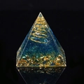 Blue resin Orgone pyramid with golden spiral coil and gold foil on black background - Blue Glass