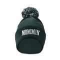 Close-up of MOMMIN' 3D embroidery on a dark green knitted beanie with pom-pom - Dark Green