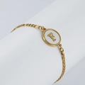 Elegant 18K gold-plated stainless steel chain bracelet featuring a shell letter F pendant - Letter F / Gold/White Shell
